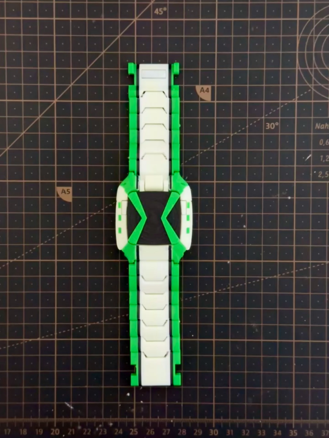 Omnitrix watch hinge and dial details — close up